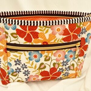 Floral Cosmetic Bag with Red and Blue Accents